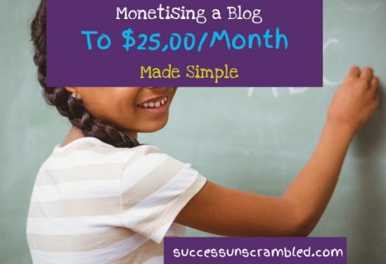 a smiling kid writing on a blackboard