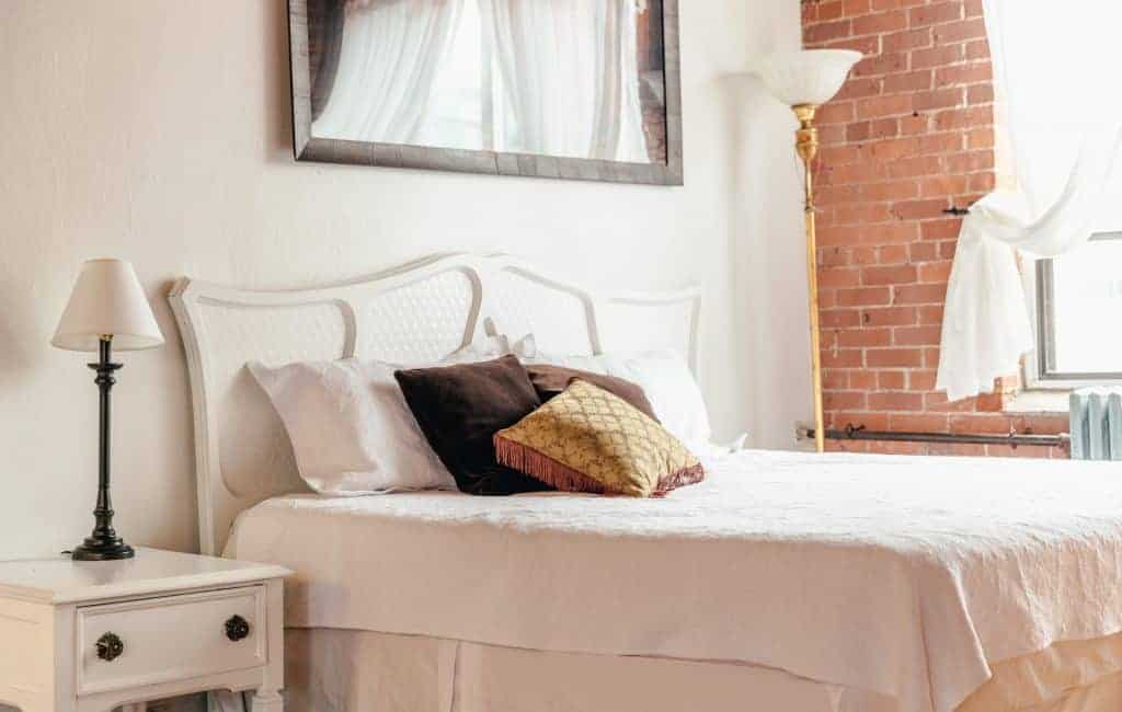 loftstyle bedroom with throw pillow