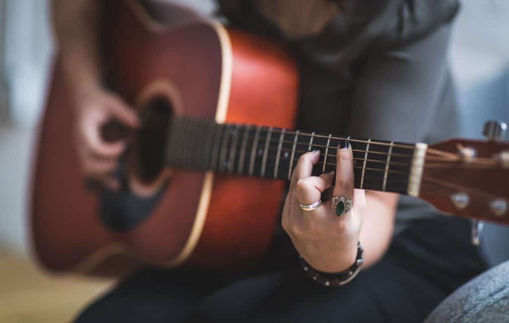 woman playing guitar