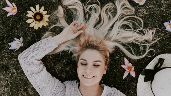 woman lying on a green grass