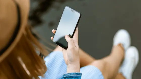 woman's hand holding a phone