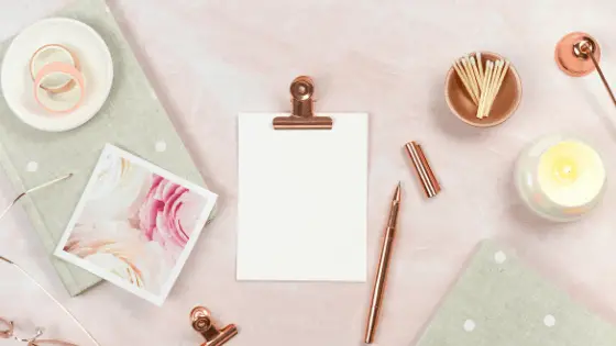clipped white paper next to a pen