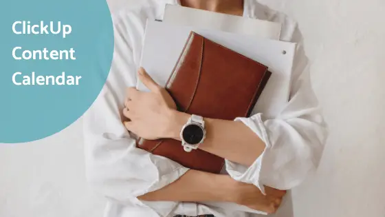 woman holding her brown leather journal