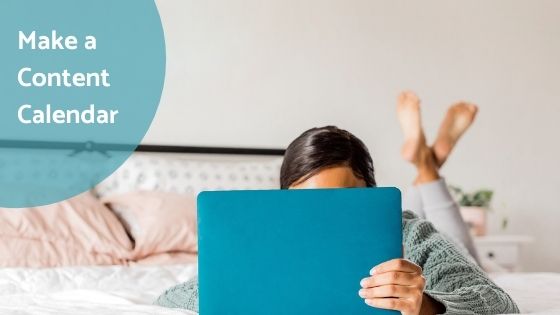 woman lying on bed while working