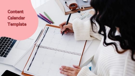 woman writing on her planner