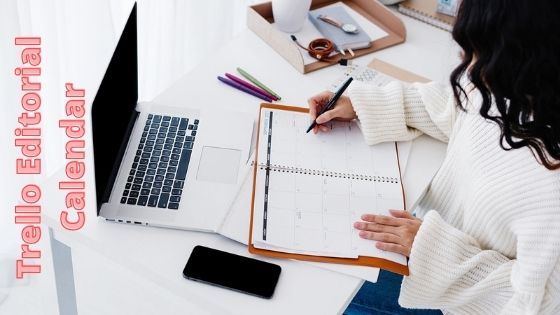 woman writing on her scheduler