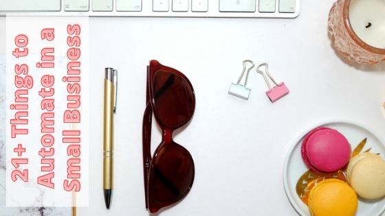 bowl of macarons next to paper clips, sunglasses and a pen
