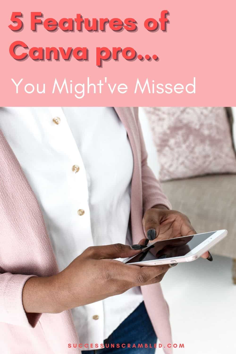photo of woman in a pink jacket holding a smartphone