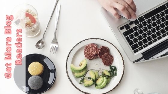photo of a laptop next to a breakfast spread