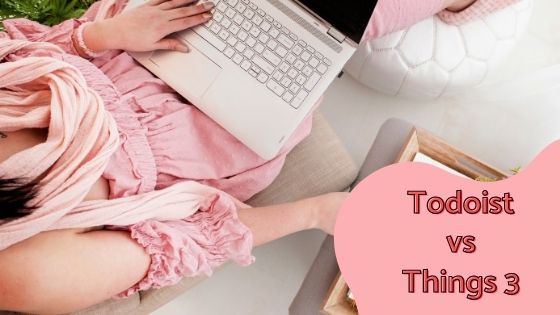 a photo of a woman's left hand on a laptop keyboard