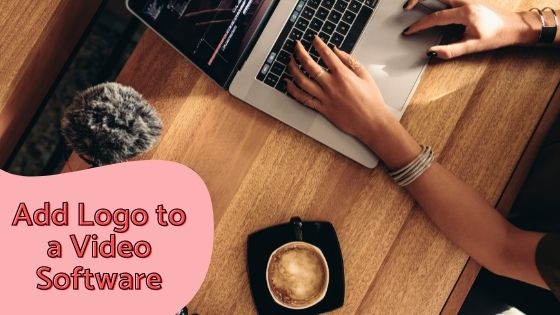 woman using her MacBook on  wooden desk