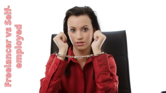 woman sitting on an office chair while being handcuffed
