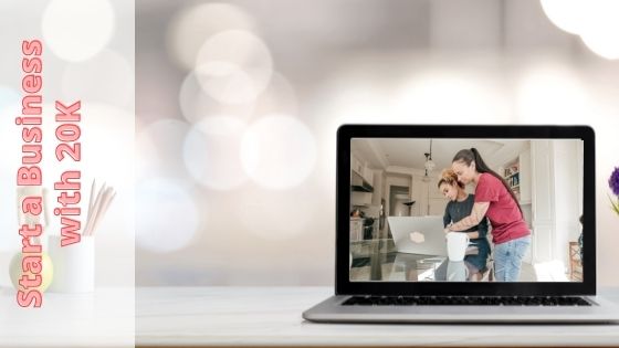 laptop with a screen photo of a mother assisting her daughter with her laptop