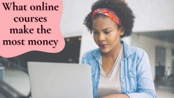 photo of a woman with a red band in her hair while sitting at a laptop and staring into the screen