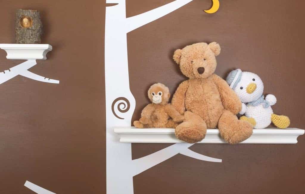 stuffy animals displayed on a nursery room