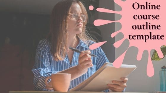 photo of a woman with a pen in one hand and writing pad in another