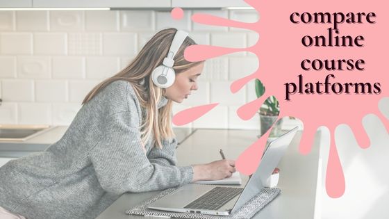 photo of a woman sitting in front of her laptop with white headphones on her head and she is taking notes