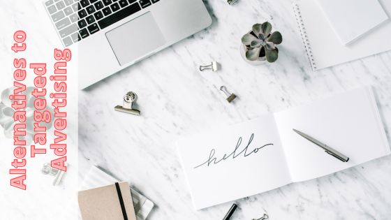 photo of a laptop on a desk with office accessories around it