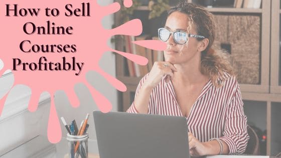 Photo of a women wearing a striped shirt sitting in front of her laptop thinking about selling courses online profitably