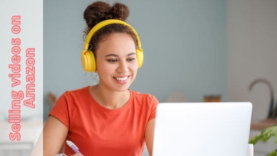 A photo of a student with yellow headphones on, taking a course online via a laptop