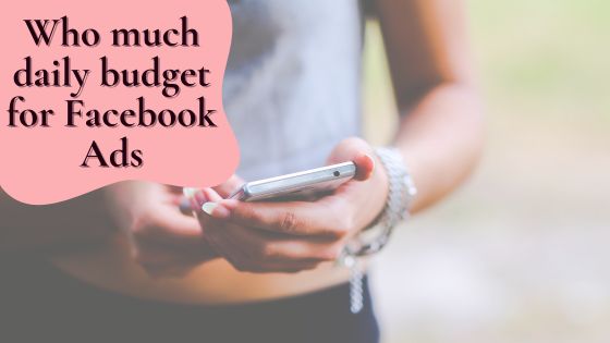Photo of a person holding a smartphone in their hands trying to figure out how much to spend on Facebook ads