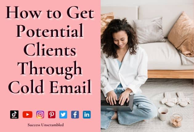 photo of a woman smiling as she sits on the floor in front of her laptop sending cold emails to potential clients